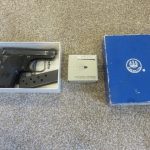 PISTOL IN BOX WITH BOX OF AMMO
