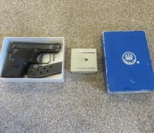 PISTOL IN BOX WITH BOX OF AMMO