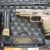 LEFT SIDE OF PISTOL WITH 17 ROUND MAGAZINE INSTALLED AND TWO 21 ROUND SPARE MAGS