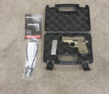 SIG PISTOL IN BOX WITH EXTENDED MAG IN PISTOL AND NON-EXTENDED MAG ON SIDE.AND PAPERWORK JPG