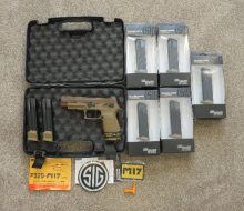 OVERHEAD VIEW SHOWING SIG MODEL 17 AND ALL MAGAZINES AND ALL PAPERWORK