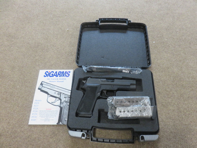 CASE OPEN SHOWING PISTOL AND 2 SPARE MAGAZINES AND INSTRUCTIONS CASE OPEN SHOWING PISTOL AND 2 SPARE MAGAZINES AND INSTRUCTIONS